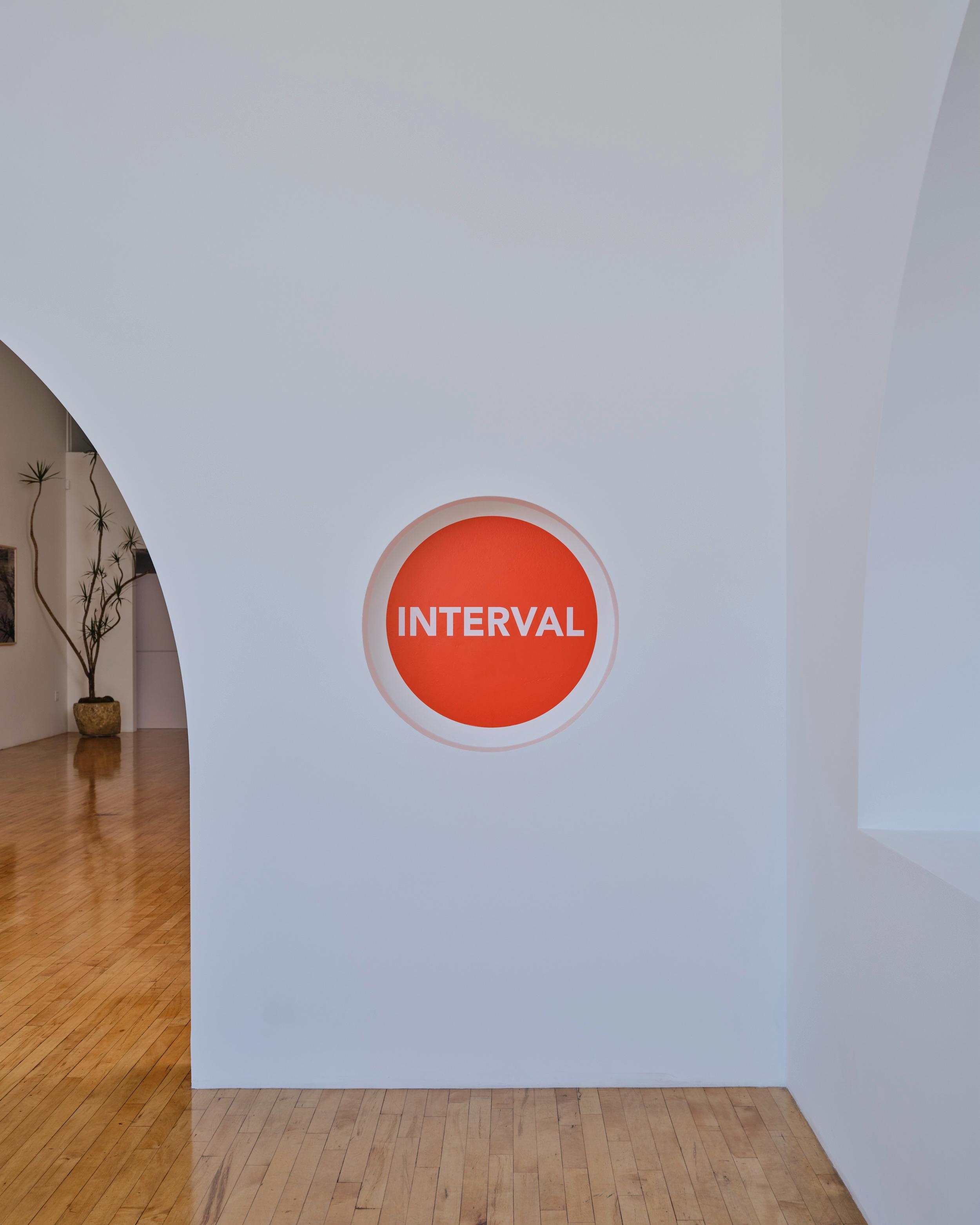 The Interval mark on the gallery wall